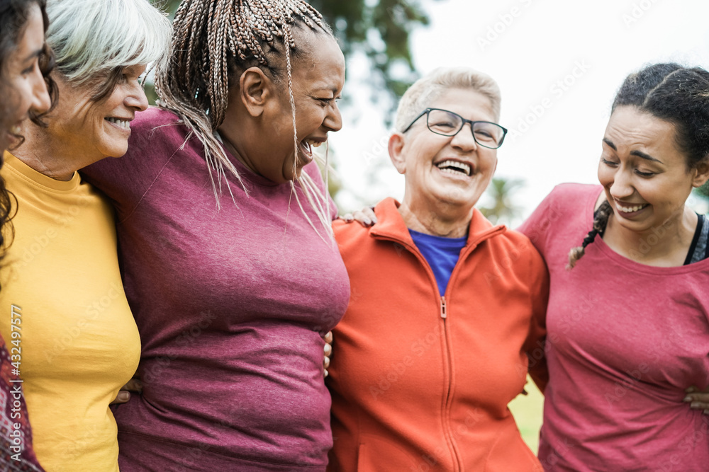 Wall mural happy multi generational women having fun together after sport workout outdoor - focus on right woma