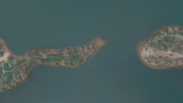 peninsula top view. two peninsulas near each other almost touch each other create a small bay at the mouth of the river. 4k aerial