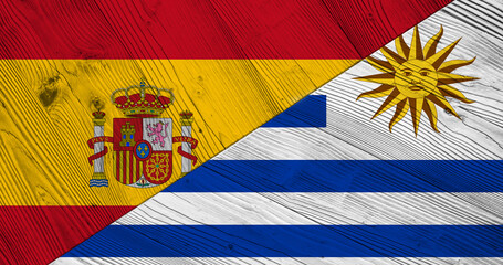 Flag of  Spain and Uruguay on wooden planks