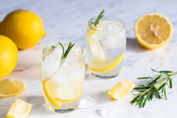 Lemon cocktail with rosemary and ice.