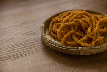 Murukku is a savory, crunchy snack originating from the Indian subcontinent.Its an Indian traditional tea time snack chakli, a deep fried snack, It is known as Chakali, Muruku, Murkoo, Chakri.