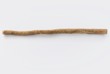 The miswak, miswaak, siwak, sewak, Arabic is a teeth cleaning twig made from the Salvadora persica tree. Miswak isolated on white.