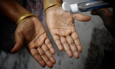 Hyderabad, India - may 08, 2021: women washing hands with alcohol gel or antibacterial soap...