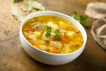 Traditional homemade salmon soup with vegetables