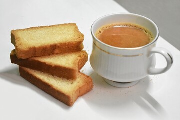 indian punjabi or Delhi bread or tutti fruitti flavoured toast, served with indian hot tea, selective focus texture