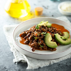 Traditional bean ragout with beef and avocado