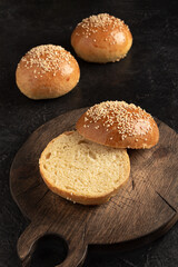 ready-made burger buns on a wooden cutting board. Home cooking