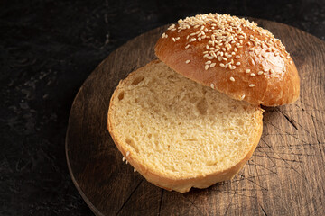 ready-made burger buns on a wooden cutting board. Home cooking