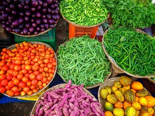 big choice of fresh fruits and vegetables on market counter,India.