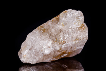 Macro mineral stone Rutile in quartz on black background