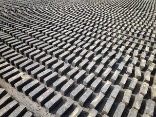 Red bricks on pallets, a warehouse for storing building materials. Brick Manufacturing factory located in rural India