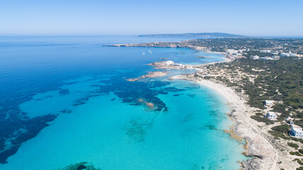 Sunny day on amazing beach with turquoise sea seen from a drone