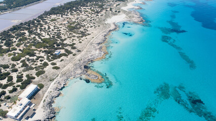 Sunny day on amazing beach with turquoise sea seen from a drone