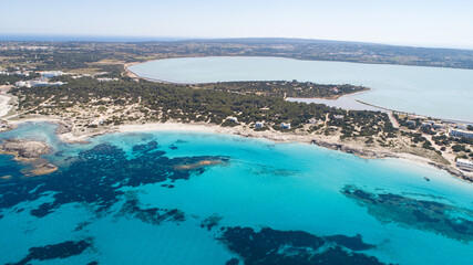 Sunny day on amazing beach with turquoise sea seen from a drone