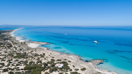Sunny day on amazing beach with turquoise sea seen from a drone