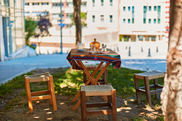 Traditional Turkish tea glasses. On the table of a street cafe, summer day