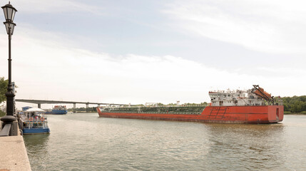 Fototapeta na wymiar Tanker follows along the banks of the River Don