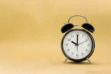 Black alarm clock and space for text