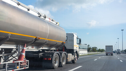 Gas Truck on highway road with tank oil container, transportation concept.,import,export logistic industrial Transporting Land transport on the asphalt expressway with blue sky