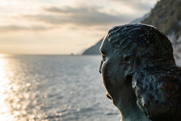 Statue of a person watching the sea (Mother Nature)