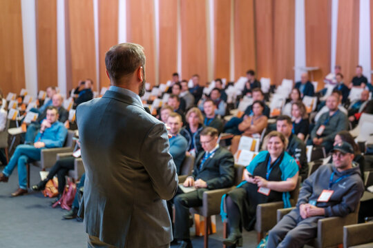 Male presenter speaks to audiences at seminar