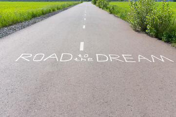Road with inspiring inscription on it: "Road to the Dream".