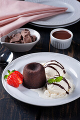Petit Gateau with ice cream and strawberry on white plate