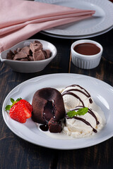 Petit Gateau with ice cream and strawberry on white plate