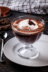 .Beautiful bowl of vanilla ice cream with hot chocolate sauce. A kind of Affogato