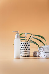 eco bamboo toothbrushes. Brown color. Morning oral care routine. Beige neutral background. Copy space. Hygiene prevent washing, zero waste, environmental friendliness