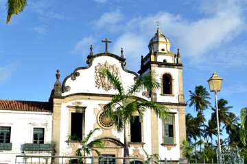 Fototapeta na wymiar a church with coconut trees in the background
