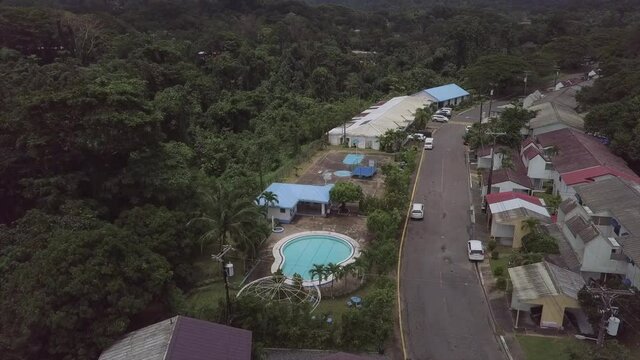Aerial Shot Of Houses In Town, Drone Flying Forward Over Road - Subic, Philippines