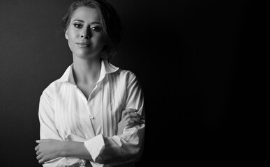 Monochrome portrait of a stylish young woman at studio