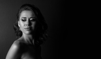 Monochrome portrait of an attractive young woman at studio