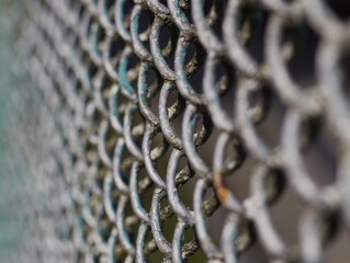 Metallic fence wall background close up surface.