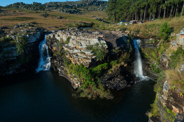 Fototapeta na wymiar Beautiful slow shutter waterfall in Nelspruit South Africa, Water Cascading down a mountain side over the rocky terrain