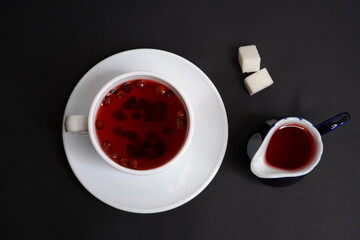 Fototapeta na wymiar Fruit tea on a black background.