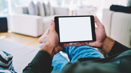 Man using tablet for watching video