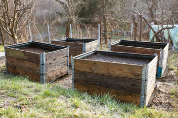 Fototapeta na wymiar pallet collar raised beds for vegetables planting. modern agriculture