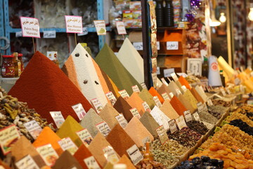 Spices pyramids and dry fruits in spice store of west algeria