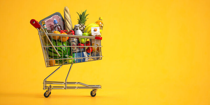 Shopping cart full of food on yellow background. Grocery and food store concept.