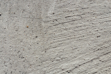 Background from a side of a concrete wall in natural light outside.
