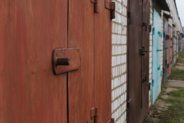 A row of garages built for cars but is often used or let for storage.Close-up