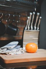 Oranges on the cutting board in a modern style kitchen.