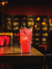 Sea Breeze cocktail in glass with ice on bar counter