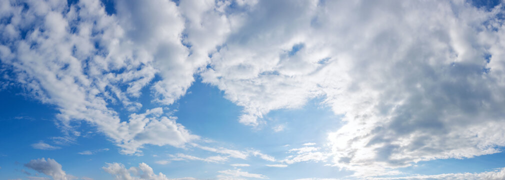 fluffy clouds on the blue sky in afternoon. beautiful nature background. panoramic view