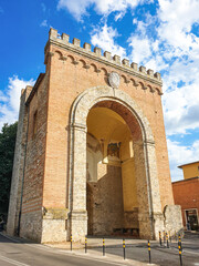Ancient tower of the walls of the medieval city of Sienna in Tuscany, Italy.On a sunny day with blue sky.