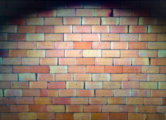 Bricks wall texture background with light spotted at the center