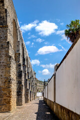 Path between the Arches of Aqueduct and the wall of the Botanical Garden of Coimbra,