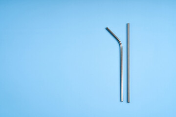 The modern trend towards caring for the environment. Two reusable metal beverage straws